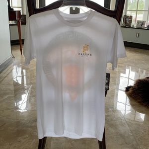T-Shirt is a size small never worn, white with a design on the back.